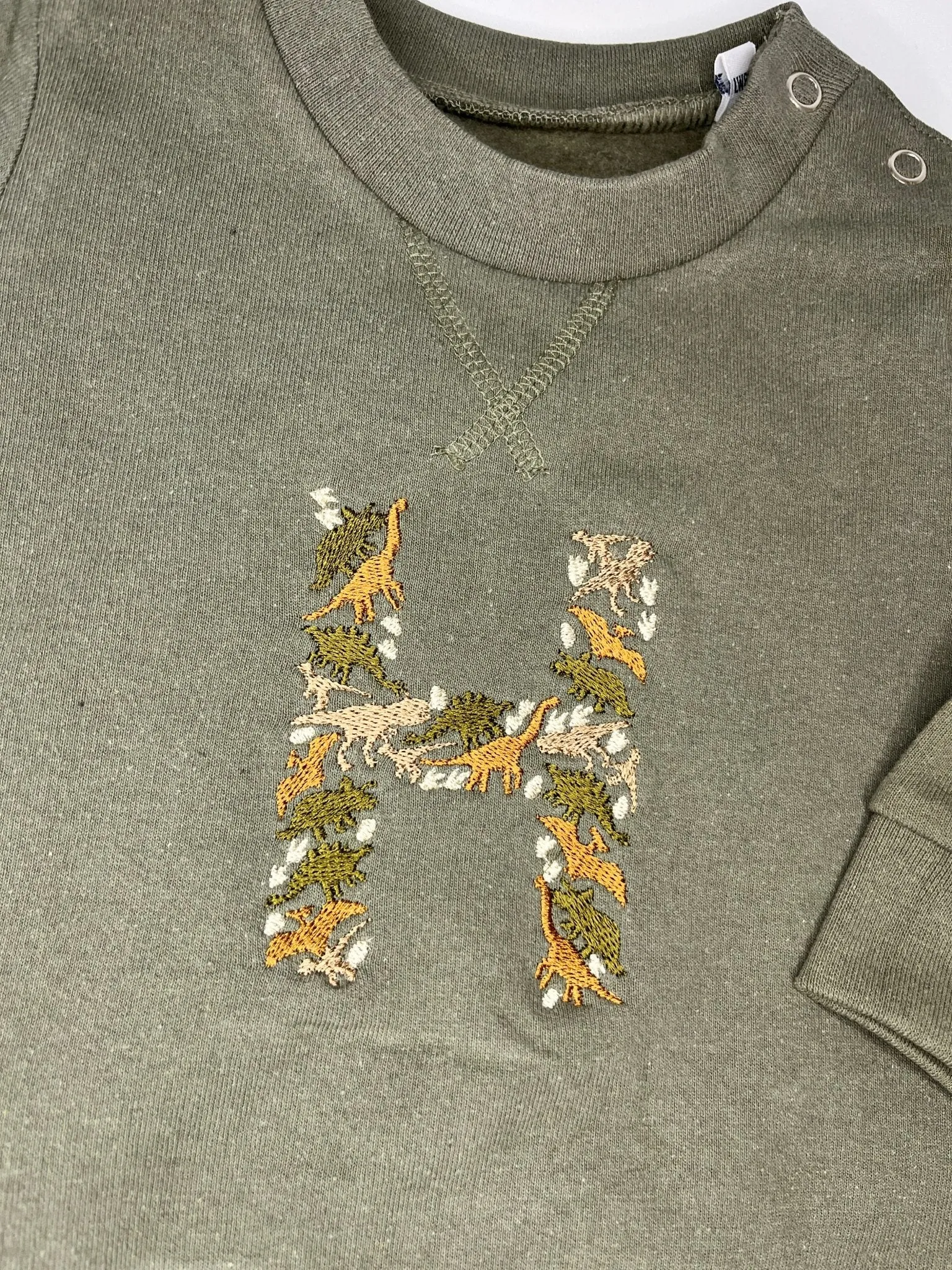 Khaki Green Dino Initial Sweater